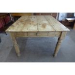 A Victorian style pine single drawer farmhouse kitchen table