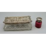 A silver topped glass jar, embossed with scene, Chester 1907, and a small ruby glass scent bottle