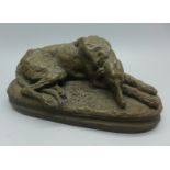 After Paul Joseph Raymond Gayrard (1807-1855), a bronzed figure of a sleeping deerhound, signed,