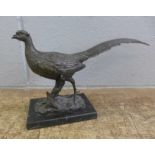 A bronze figure of a pheasant on an onyx plinth, 31cm