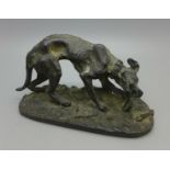 After P.J. Mene, a bronze figure of a dog chewing on a bone, signed, 10cm