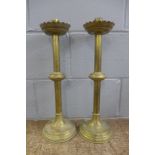 A pair of tall brass ecclesiastical candlesticks, 50cm