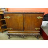 An Edward VII Chippendale Revival carved mahogany press cupboard