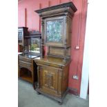 A 19th Century French carved oak and stained glass side cabinet