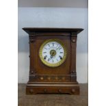 A Victorian oak Fattorini & Sons oak mantel clock