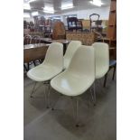 A set of four Eames style white perspex and chrome Eiffel chairs