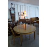 A G-Plan Fresco teak extending dining table and four chairs