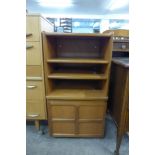 A Nathan teak single door cabinet