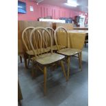 A set of four Ercol Blonde elm and beech Windsor chairs