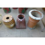Two terracotta chimney-pots and a glazed stoneware barrel