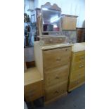 A pine three drawer chest and a pine toilet mirror