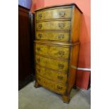 A George III style burr walnut chest of drawers