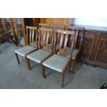 A set of six teak dining chairs