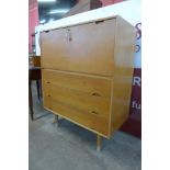A Hille beech and cherrywood Hilleplan unit J writing cabinet, designed by Robin Day