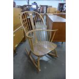 An Ercol Blonde elm and beech Chairmakers armchair