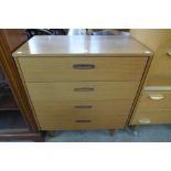 A teak chest of drawers