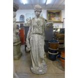 A concrete garden figure of a Grecian lady water carrier