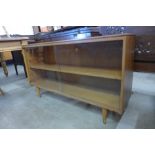 A small tola wood bookcase