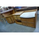 A Nathan teak telephone seat and a corner cabinet