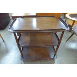 An Ercol Golden Dawn elm and beech three tier trolley