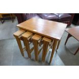 A Danish Poul Hundevad teak nest of tables