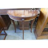 A small mahogany demi lune hall table