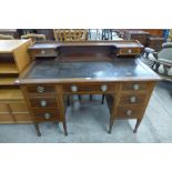 An Edward VII inlaid mahogany desk