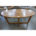 A teak oval table