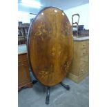 A Victorian inlaid walnut oval tilt top loo table