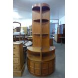 A pair of Nathan teak freestanding corner cabinets