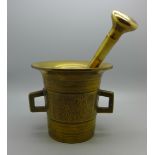 A bronze pestle and mortar