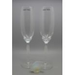 A Lalique glass fish and two Lalique champagne flutes