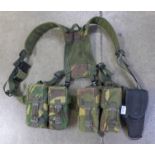 An Army combat harness with gun holster