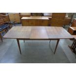 An Archie Shine teak extending Hamilton dining table, designed by Robert Heritage