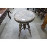 A Victorian beech revolving kitchen stool