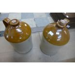 A pair of glazed stoneware flagons