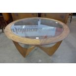 A G-Plan Astro teak and glass topped circular coffee table