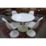 An Arkana style white laminate tulip shaped dining table and four chairs