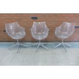 A set of three Italian Driade Meridiana perspex and chrome revolving chairs, designed by