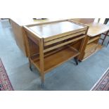 A teak metamorphic trolley