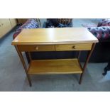 A teak two drawer side table