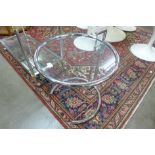 An Eileen Gray style chrome and glass topped occasional table