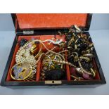 A Japanese lacquered jewellery box and costume jewellery