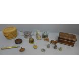 A carved wooden box, a carved dog, two souvenir cow bells, a plated mustard, etc.