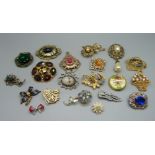 Sixteen costume brooches, a pendant, etc.