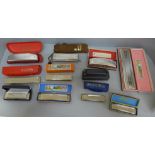 A collection of eleven Hohner harmonicas including The Echo Harp and Educator II