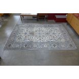 A Persian Kashan rug, 292 x 195cms