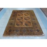 A hand knotted Afghan mustard ground rug