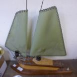 A teak sailing boat lamp