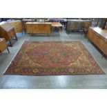 An early 20th Century hand knotted Persian Herris rug, 322 x 240cms